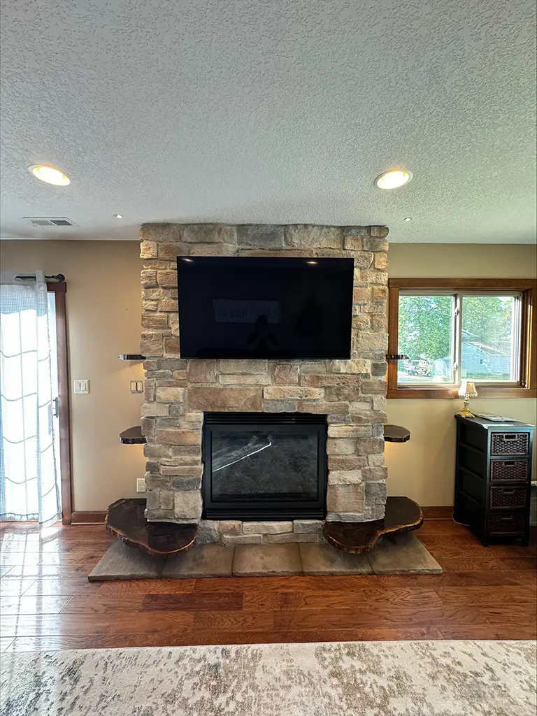 Beautiful stone fireplace by River City Fireplaces