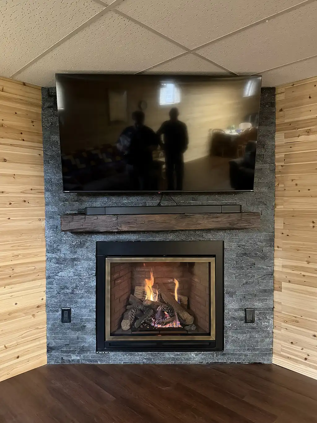 corner custom fireplace by by River City Fireplaces