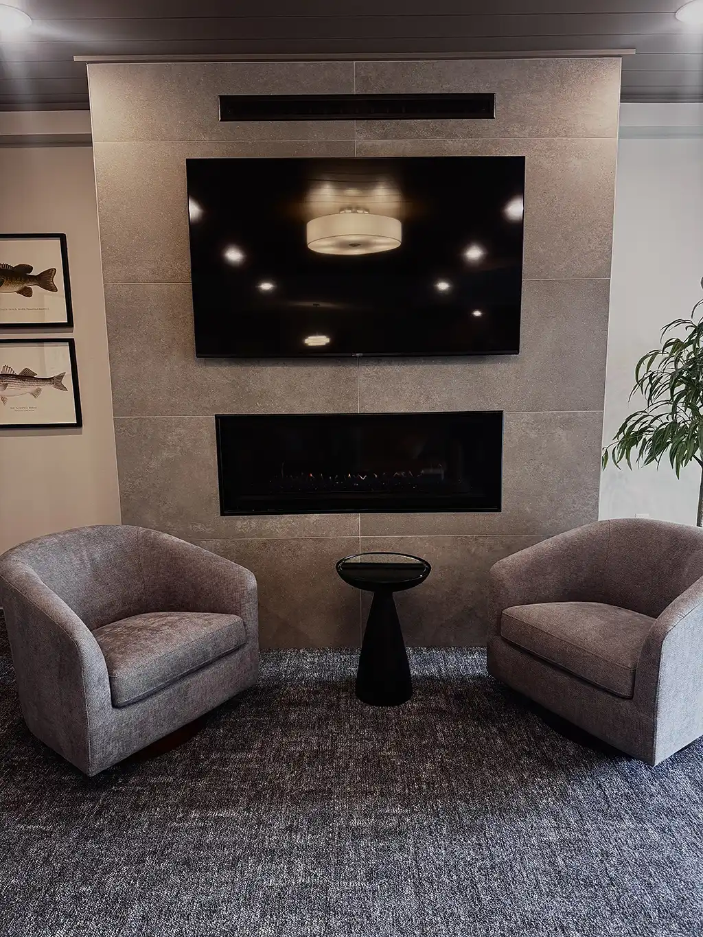 glass enclosed fireplace with tv