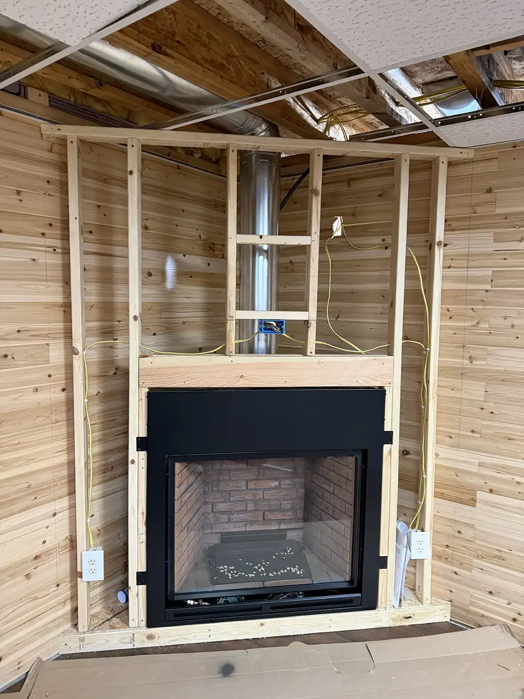 framework of custom corner fireplace by River City Fireplaces