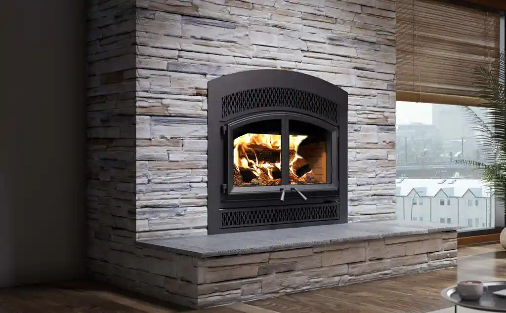wood stove built into fireplace